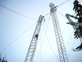 AEL&P lineman Eric Nielsen climbs the leaning tower. (Photo courtesy Alaska Electric Light & Power)