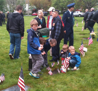 Children at grave of Army Corporal Donald Walter Sperl.