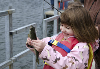 Cheyenne Herline, 5, shows off her first fish.