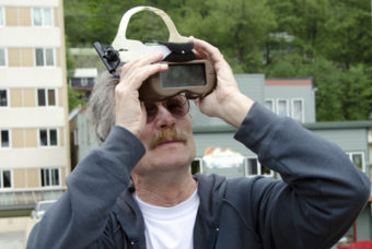 David Audet looks through protective goggles trying to gatch a glimpse of the Venus transit.