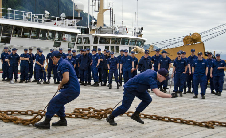 Teams pulled chains across the dock as part of the annual Coast Guard Buoy Tender Round-Up Olympics on July 18, 2012. (Photo by Heather Bryant/KTOO)
