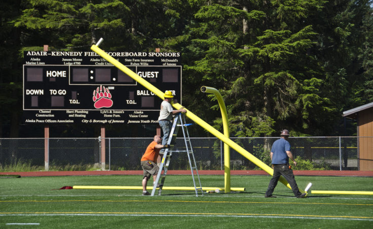 Assembling the goal post starts with the horizontal crossbar which sits 10 feet off the ground.