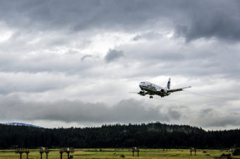 An Alaska Airlines flight comes in for a landing at the Juneau International Airport.