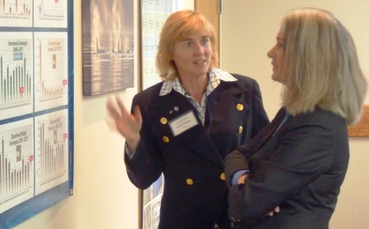 Science panel member Michelle Ridgway and Juneau Rep. Cathy Muñoz talk during the Cruise Ship Science Panel's technology open house Sept. 20 in Juneau. 