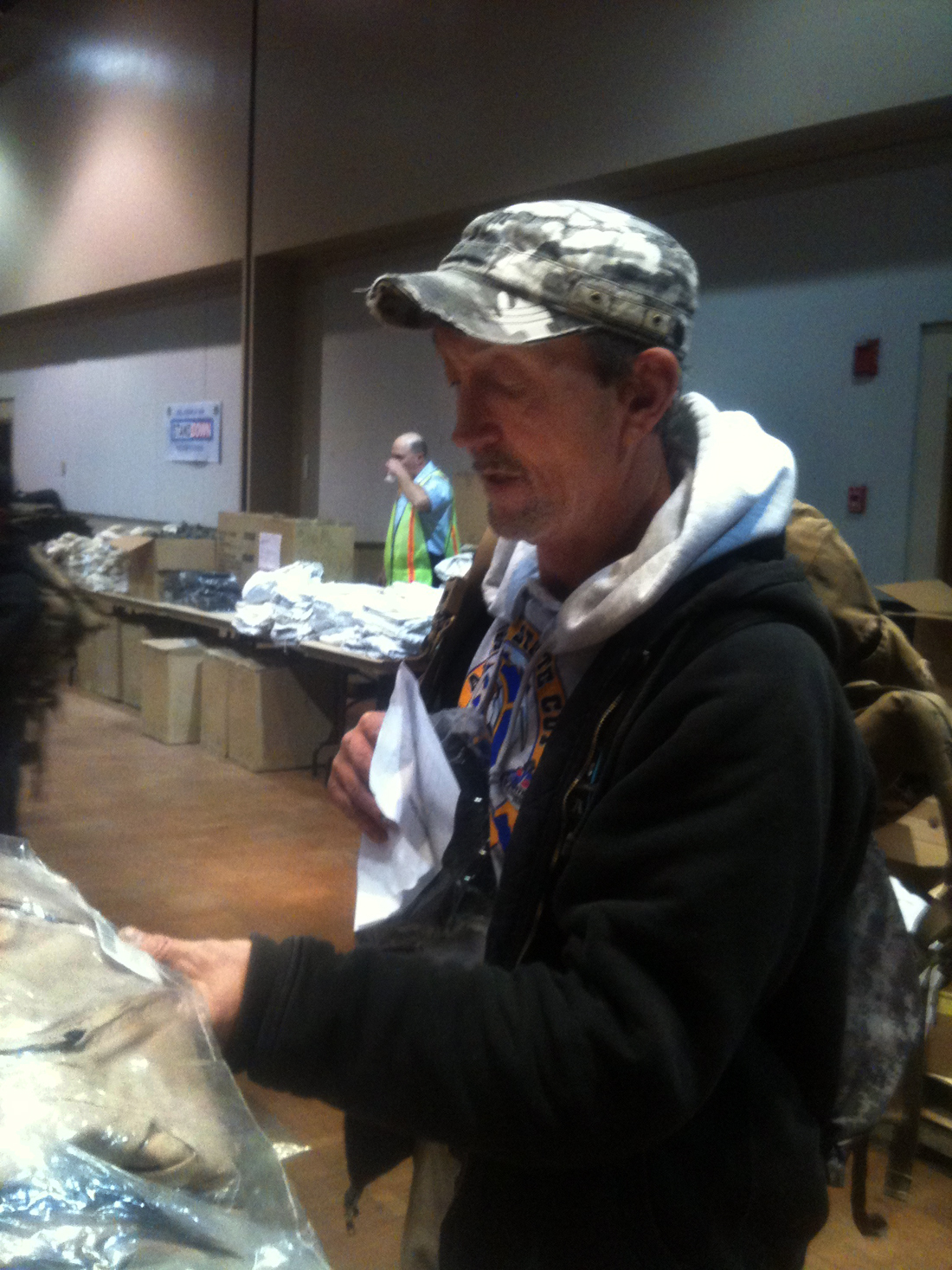 Ex-Marine Dan Roberts considers supplies offered at the Department of Veterans Affairs "Stand Down" event in Juneau.