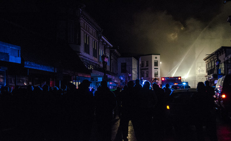 Crowds gather on Franklin Street to watch the blaze.