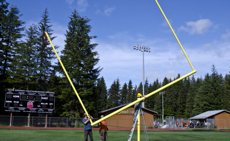 The goal posts are up and games will soon be played on the new turf field at Adair Kennedy Park in Juneau’s Mendenhall Valley. After the uprights are added the crossbar is rotated back to a level position.