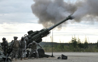 Artillerymen with C Battery, 2nd Battalion, 8th Field Artillery Regiment, 1st Stryker Brigade Combat Team, 25th Infantry Division fire an M777 Howitzer during a live-fire exercise held at Fort Wainwright's firing range Aug. 7, 2012.The exercise certified non-commissioned officers on the ability to perform a fire mission with pin point accuracy and was part of the Artillerymen Advanced Leaders Course. (U.S. Army Photo By: Sgt. Thomas Duval, 1/25th SBCT Public Affairs)