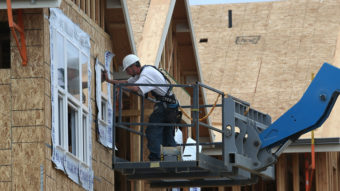 Going up: A construction worker at a housing development in San Mateo, Calif., in June 2012. Justin Sullivan/Getty Images
