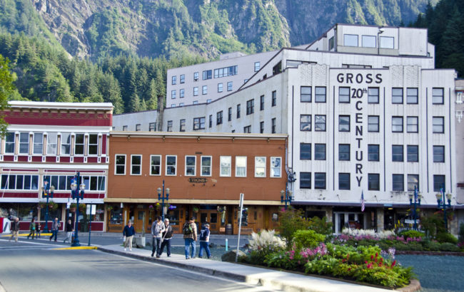 Tourists walk around downtown this past summer.