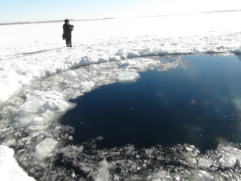 A circular hole in the ice of Chebarkul Lake, where the Chelyabinsk meteor reportedly struck on Feb. 15. Uncredited/Associated Press