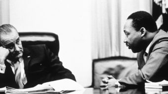 President Lyndon Johnson and civil rights leader Martin Luther King Jr. discuss the Voting Rights Act in 1965. On Wednesday, the Supreme Court hears arguments on whether a key part of the law is still needed nearly a half century after its passage. Hulton Archive/Getty Images