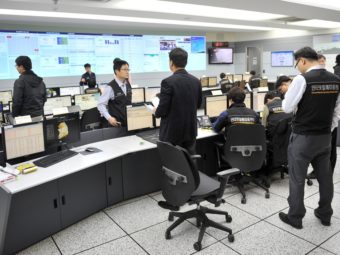 Members of the Korea Internet Security Agency check on cyberattacks at a briefing room Wednesday. Jung Yeon-Je/AFP/Getty Images
