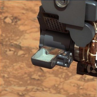 This image from NASA's Curiosity rover shows the first sample of powdered rock extracted by the rover's drill. NASA/JPL-Caltech/MSSS