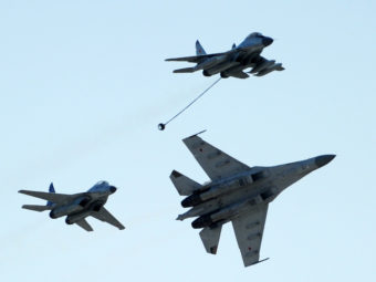 Russian MiG-29 (top), MiG-35 (left) and Su-35 (right) perform at an air show outside Moscow, in 2011. Dmitry Kostyukov/AFP/Getty Images