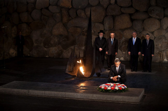 President Barack Obama pays his respects in the Hall of Remembrance in front of Israel's President Shimon Peres, Israel's Prime Minster Benjamin Netanyahu, Chairman of the Yad Vashem Directorate Avner Shalev and Rabbi Yisrael Meir Lau after marines layed a wreath on his behalf during his visit to the memorial on Friday. Uriel Sinai/Getty Images