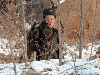 A North Korean soldier reacts as he patrols along the Yalu River near the Chinese border last month. Mark Ralston/AFP/Getty Images