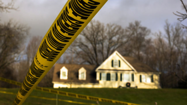 Dec. 18, 2012: Crime scene tape stretches across the property outside the home of Adam Lanza and his mother, Nancy Lanza. Inside, police found more weapons and other evidence. Lucas Jackson /Reuters /Landov