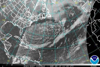 That's the coast of the U.S. on the left, the tip of Greenland at the top center and the coast of Europe on the top right. Meanwhile, the storm's tail extends down into the Caribbean. NOAA Satellite and Information Service