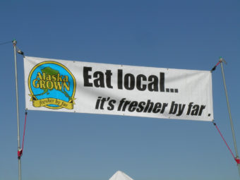Alaska Grown banner at a farmer's market