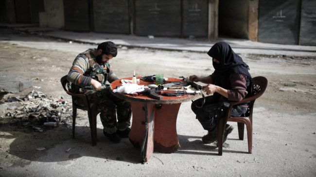 Members of Jabhat al-Nusra clean their weapons, in Aleppo in December. The Islamist rebel group has become an increasingly powerful force in Syria's civil war. Ahmed Jadallah/Reuters /Landov