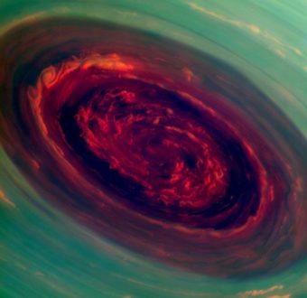 A mammoth spinning vortex is seen on Saturn, in this "false-color" photograph released by NASA Monday. The image was captured by the Cassini spacecraft. A related image, presenting what a human eye would see, is farther down this page. NASA