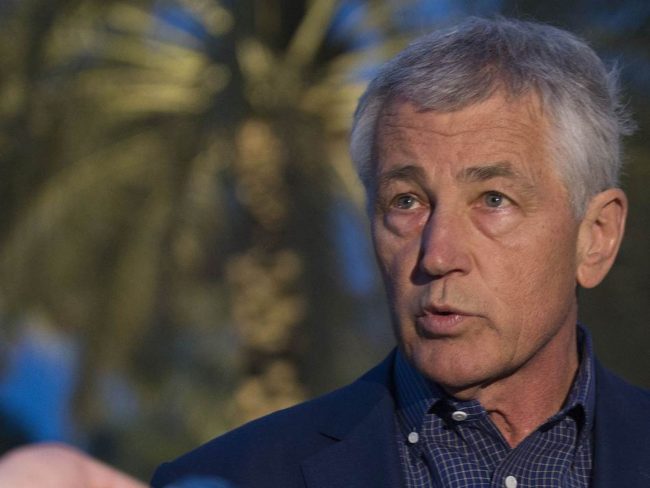 Secretary of Defense Chuck Hagel speaks with reporters on Thursday in the United Arab Emirates after reading a statement on chemical weapon use. Pool/Getty Images