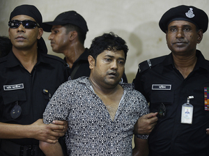 Property tycoon Sohel Rana is presented at a police news conference on Sunday. STR/AFP/Getty Images