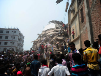 Bangladeshi volunteers and rescue workers at the site of the factory on Friday. AFP/AFP/Getty Images