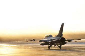 A U.S. Air Force F-16 Fighting Falcon taxis towards the flightline Oct. 27, 2011, Eielson Air Force Base, Alaska. The aircraft is assigned to the 18th Aggressor Squadron. (U.S. Air Force photo by Staff Sgt. Christopher Boitz/Released)