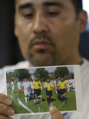 Soccer referee Ricardo Portillo died Saturday, after being struck by a player. Here, Portfillo, is seen holding a soccer ball, in a photo held by his brother-in-law, Jose Lopez, Thursday. Rick Bowmer/AP