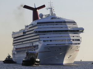 The cruise ship Carnival Triumph, seen here as it arrived in Mobile, Ala., in February, has now disembarked for the Bahamas. The powerless ship was towed to port with 3,143 passengers aboard in February.