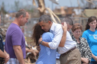 President Obama is greeted as he tours a tornado affected area on Sunday in Moore, Oklahoma. Mandel Ngan /AFP/Getty Images