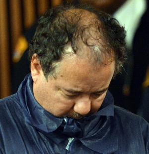 Ariel Castro during his arraignment Thursday at Cleveland Municipal Court. He's accused of kidnapping and raping three young women, and then holding a daughter born to one of those women captive. The women had been missing for about a decade. The child is now six years old. Emmanuel Dunand /AFP/Getty Images