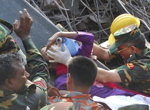 Rescuers carry a survivor who was buried for 17 days under the rubble of a building that collapsed in Saver, near Dhaka, Bangladesh. Parvez Ahmad Rony/AP
