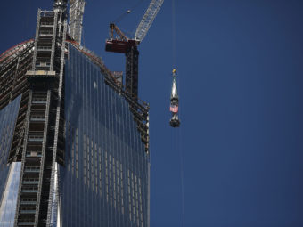 The 408-foot spire was hoisted onto a temporary platform at the top of One World Trade Center on Thursday. Spencer Platt/Getty Images