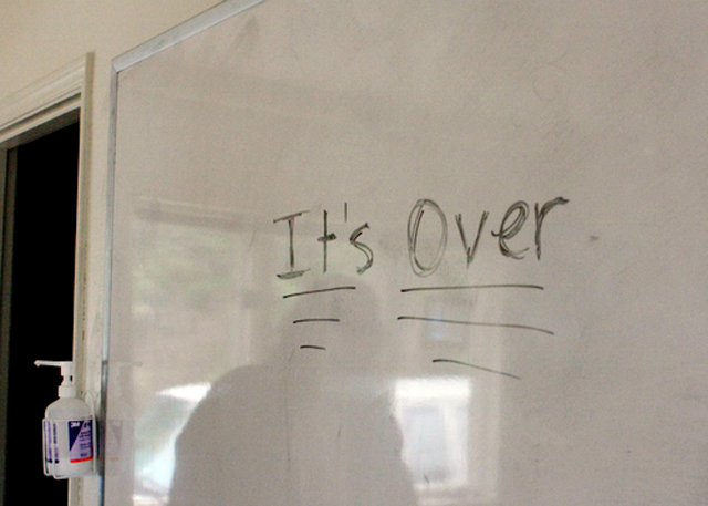 It's over is written on a white board inside  the house where clients lived during their stay at the residential treatment program.