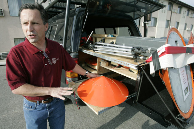 Tornado chaser Tim Samaras shows the probes he uses when trying to collect data from a tornado. This photo was taken May 26, 2006, in Ames, Iowa. Charlie Neibergall/AP