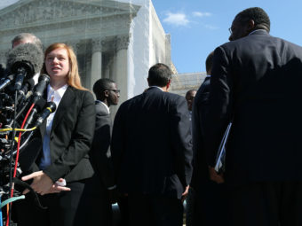 Abigail Noel Fisher, who challenged a racial component to University of Texas at Austin's admissions policy, speaks to the media outside the U.S. Supreme Court building during oral in the case in October. Mark Wilson/Getty Images