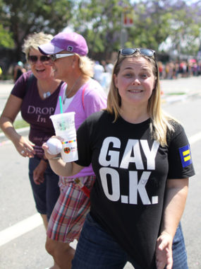 A new survey of more than 1,000 lesbian, gay, bisexual, and transgender adults finds that more than 90 percent feel more accepted in society than they did 10 years ago. Here, a woman displays her pro-gay T-shirt at the L.A. Pride Parade in West Hollywood last Sunday. David McNew/Getty Images