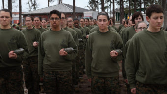 Women in the U.S. military will be integrated into front-line combat units by 2016, the Pentagon says. Here, female Marine recruits stand in formation during pugil stick training in boot camp earlier this year at Parris Island, S.C. Scott Olson/Getty Images