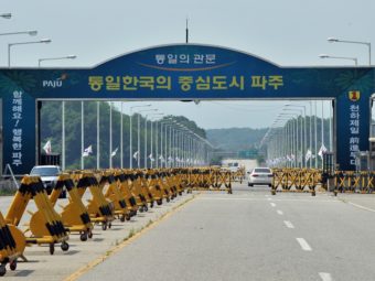Cars drive past barricades on the road linking North Korea's Kaesong Industrial Complex at a military checkpoint in Paju, near the demilitarized zone dividing the two Koreas, on Thursday. Jung Yeon-je/AFP/Getty Images