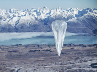 A Google balloon sails through the air with the Southern Alps in the background, in Tekapo, New Zealand, on Monday. Jon Shenk/AP