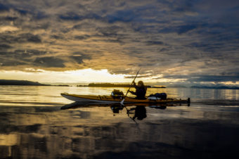 The "A Trip South" team kayaks down the Inside Passage during sunset. Photo courtesy of Lia Heifitz.