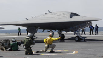 A Navy X-47B drone, seen here last month being launched off the aircraft carrier USS George H. W. Bush, successfully landed on the ship Wednesday, a first. Steve Helber/AP