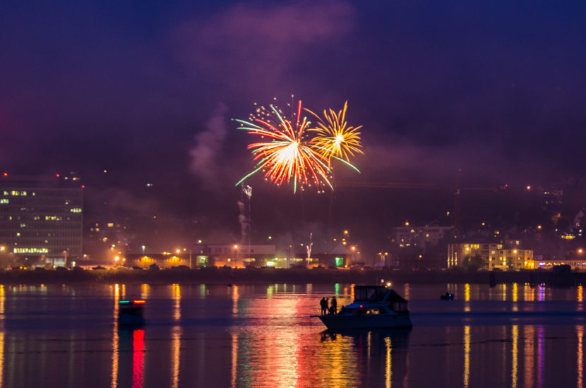 Boats anchored in Juneau's harbor watch the fireworks.