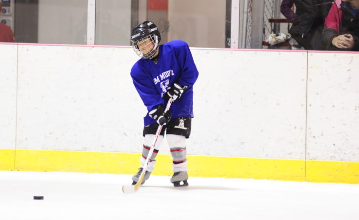 Kieren Tagsib passes the puck during during JDIA’s Learn to Play event Saturday at Treadwell Ice Arena.