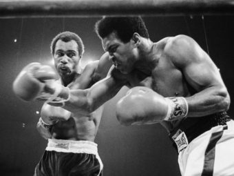 Muhammad Ali, right, winces as Ken Norton hits him with a left to the head in their scheduled 12-round re-match, Sept. 10, 1973 at the Forum in Inglewood, California. AP