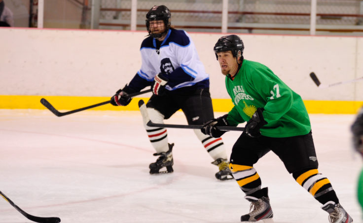 Mason Morriss (right) and Thomas McKenzie have their sights set on the play in a Tier B game between Alaska Airlines and the Green team during JAHA’s round of opening day games.