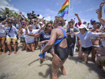 United States endurance swimmer Diana Nyad is greeted by a crowd as she walks on to the Key West, Fla., shore today. J Pat Carter/AP